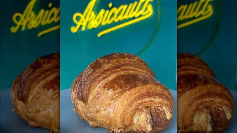 Ham and cheese croissant with blue background