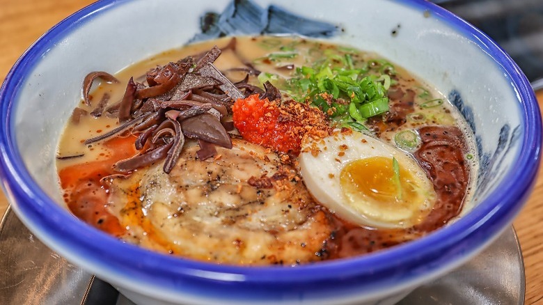 Blue and white bowl with ramen toppings