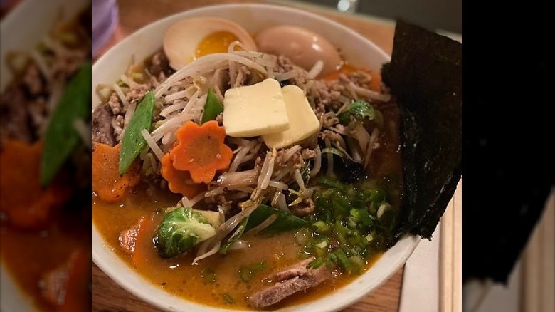 Noodles and beans in broth with vegetables