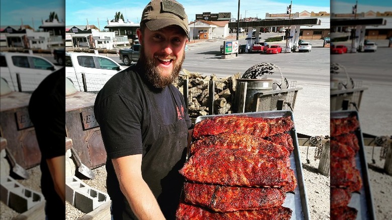 Person holding tray of ribs