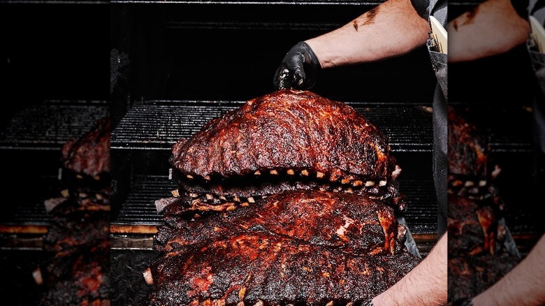 Person holding short ribs