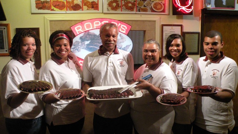 Roper's Ribs employees holding ribs 