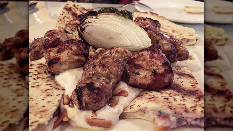 Plate of shawarma with pita