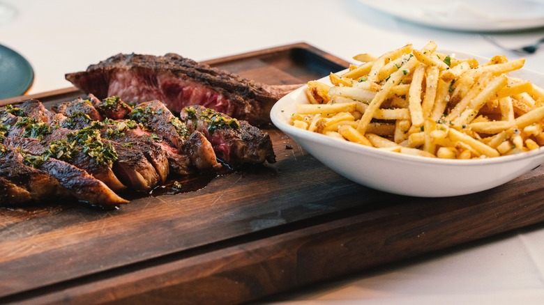 sliced ribeye steak with fries