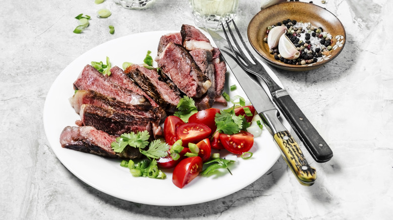 Steak with salad on plate