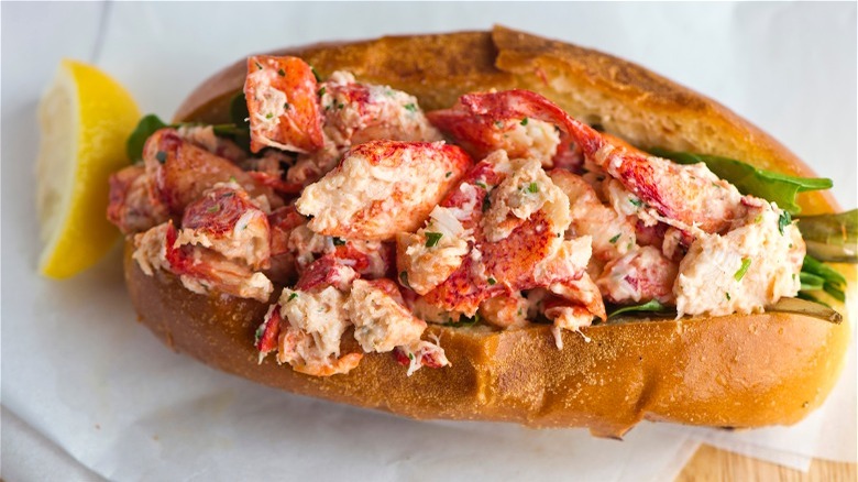 Lobster roll with lemon wedge