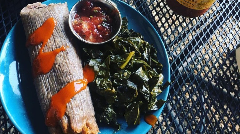 vegan tamale with sauted greens and salsa