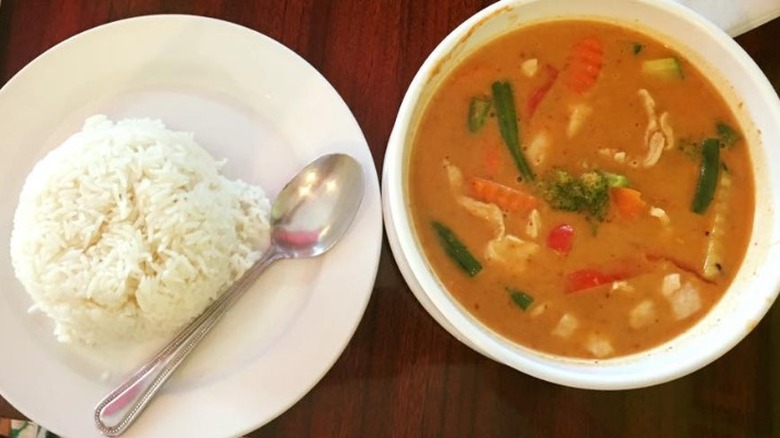 A bowl of Thai curry and rice