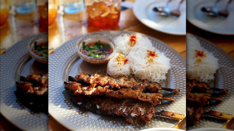 Chicken skewers and noodles