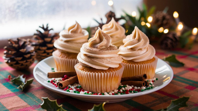 homemade eggnog cupcakes on a plate in a festive setting