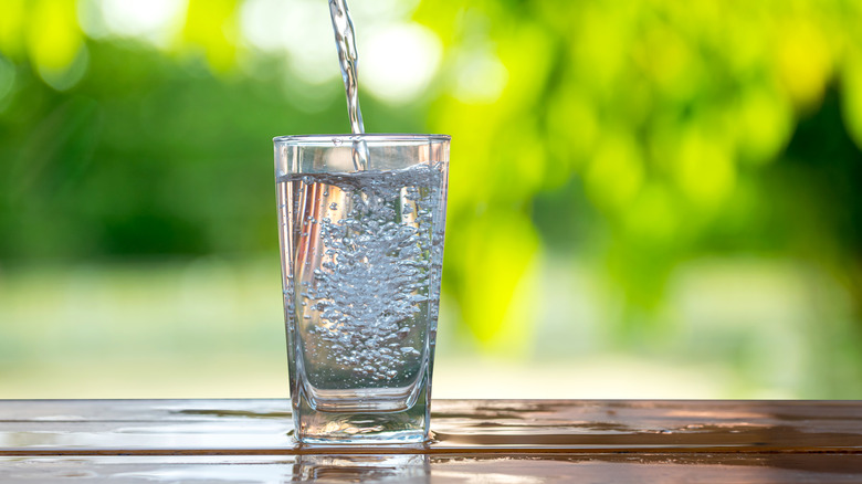 Water flowing into glass