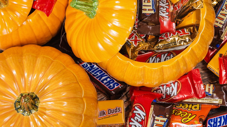 Halloween candies in pumpkin containers