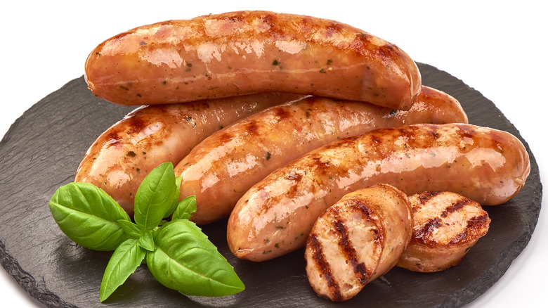 Grilled sausages, whole and sliced