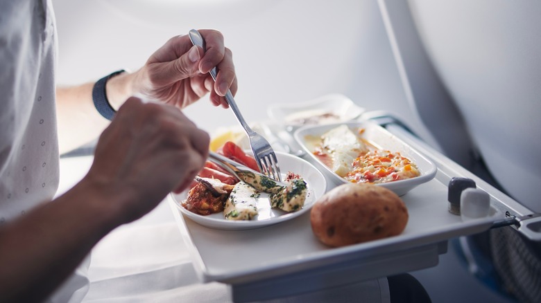 Person eating on a flight