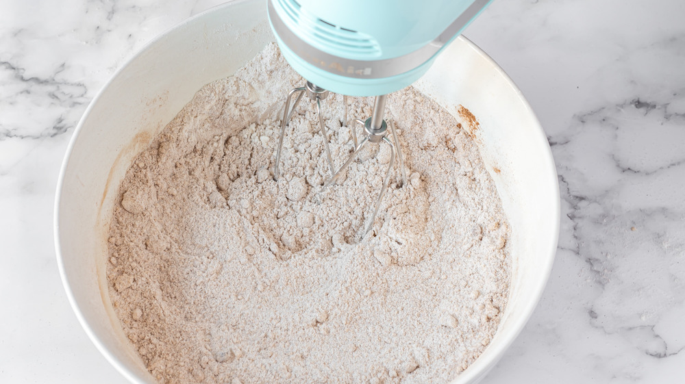 mixing dry ingredients for apple cinnamon muffins