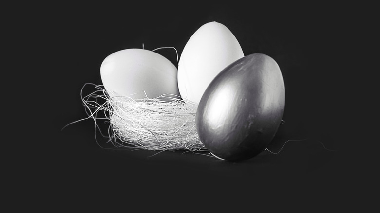 Two white eggs and one silver