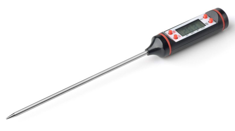 meat thermometer against white background