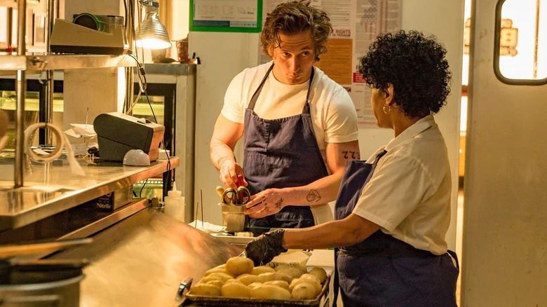 Carmy and Tina prep food