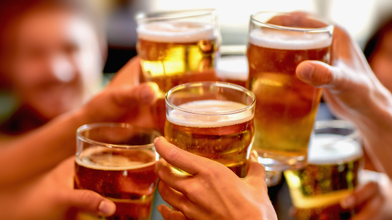 Hands with beer glasses