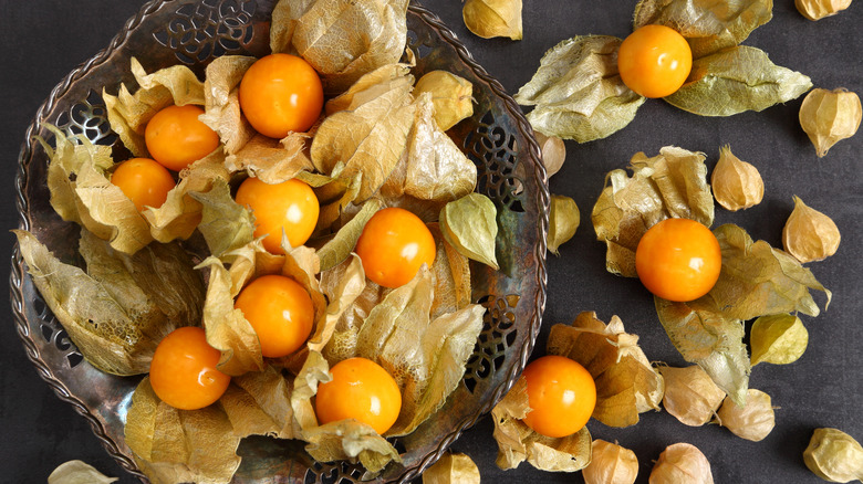 Metal basket with orange cape gooseberries