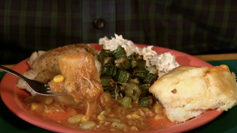 Plate of stew, meat, okra, and biscuit