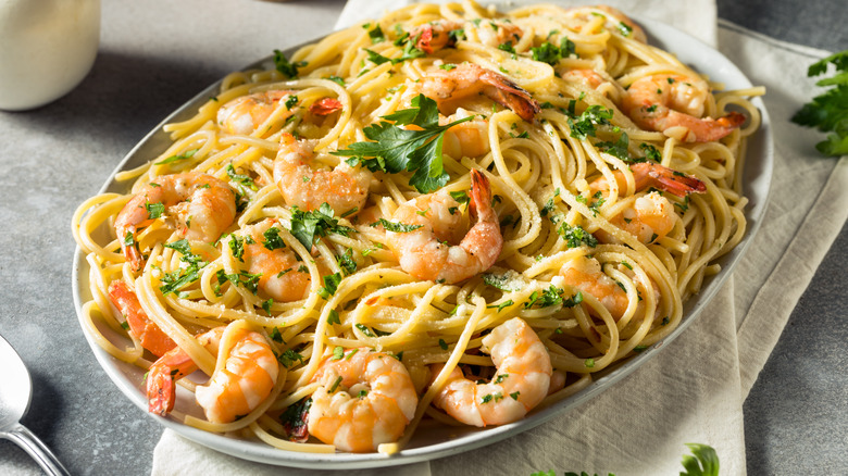 shrimp scampi atop pasta