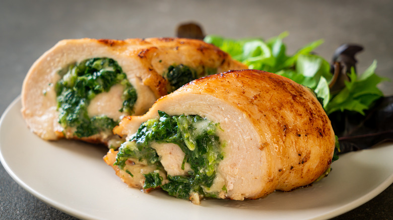 spinach stuffed chicken on plate