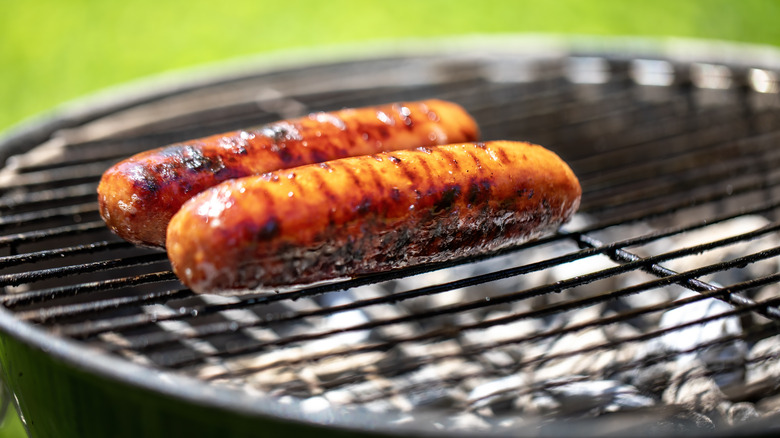 hot dogs on grill