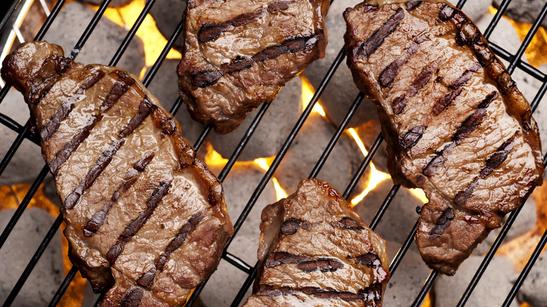 steaks on grill