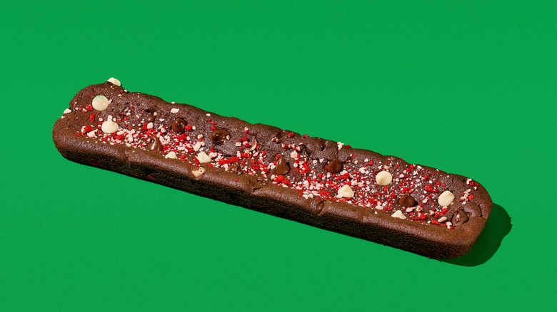 Subway Footlong Holiday Cookie against green background