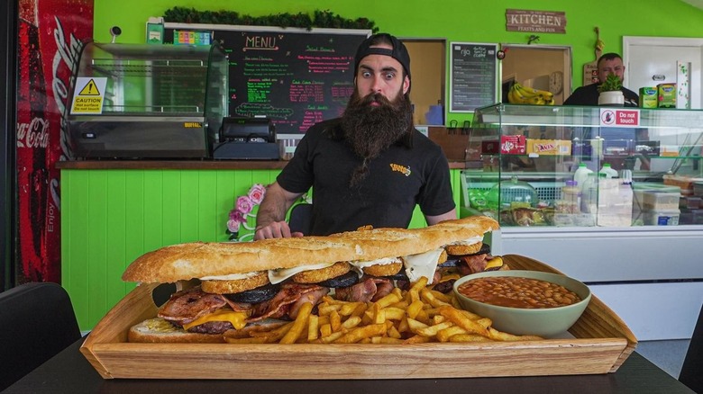 Adam Moran, Beard Meats Food, at the Breakfast Baguette Challenge at the Garden Café in Long Eaton in the United Kingdom