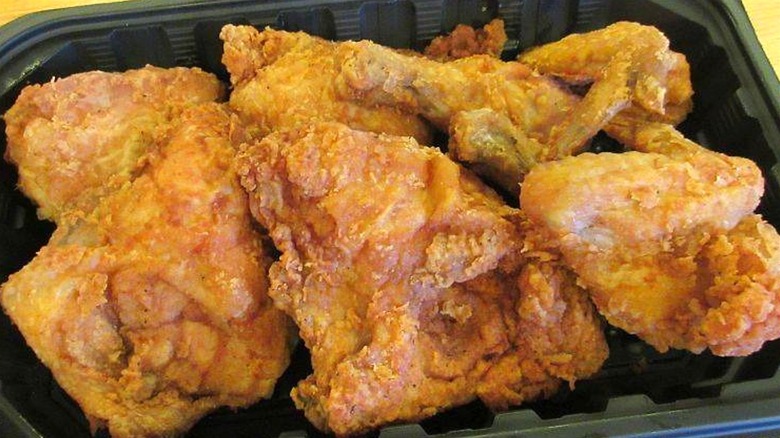 Food 4 Less fried chicken in a container