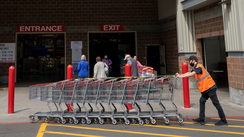 employee pushing carts