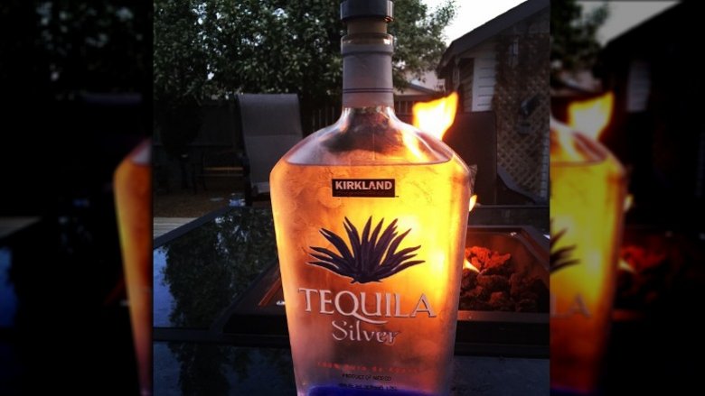 tequila bottle candlelight