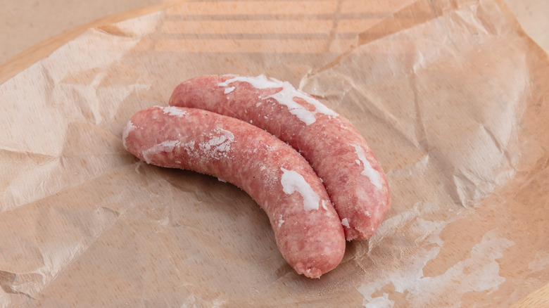 frozen sausages on greaseproof paper