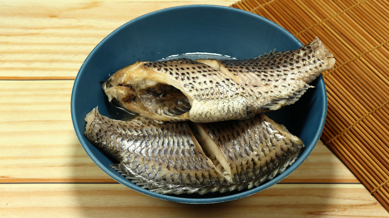 steamed tilapia in blue bowl