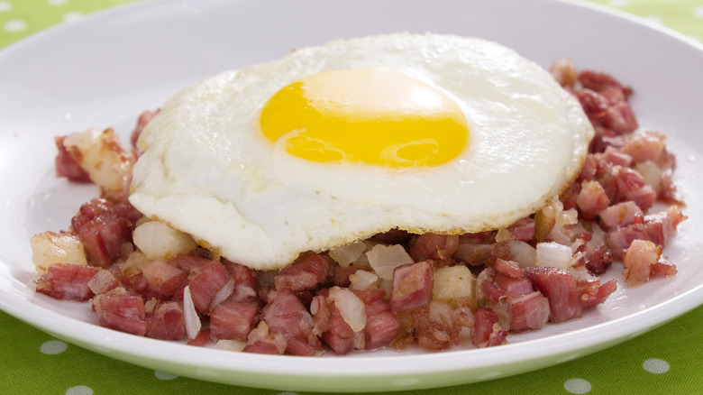 Sunny side up egg on corned beef hash