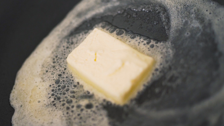 Pad of butter in skillet