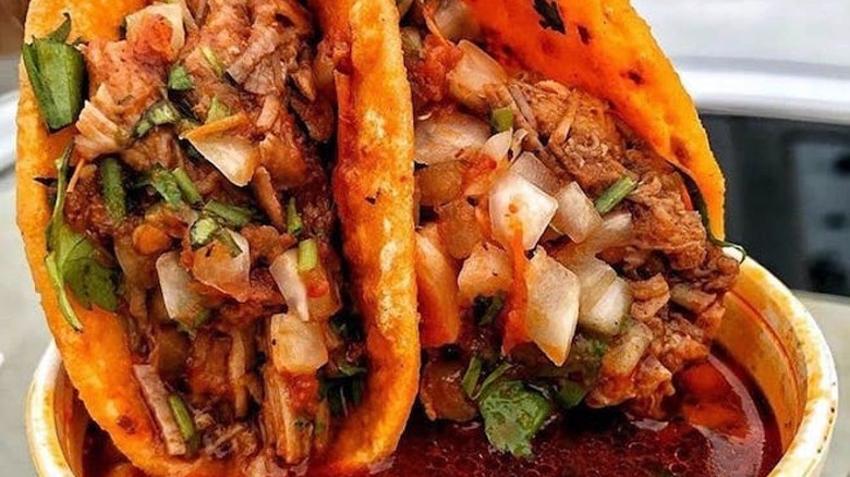 Birria tacos dipped in consomé