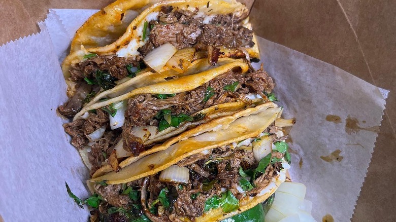 Three beef birria tacos