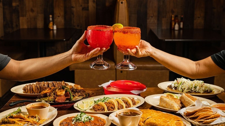 Toasting cocktails over tacos 