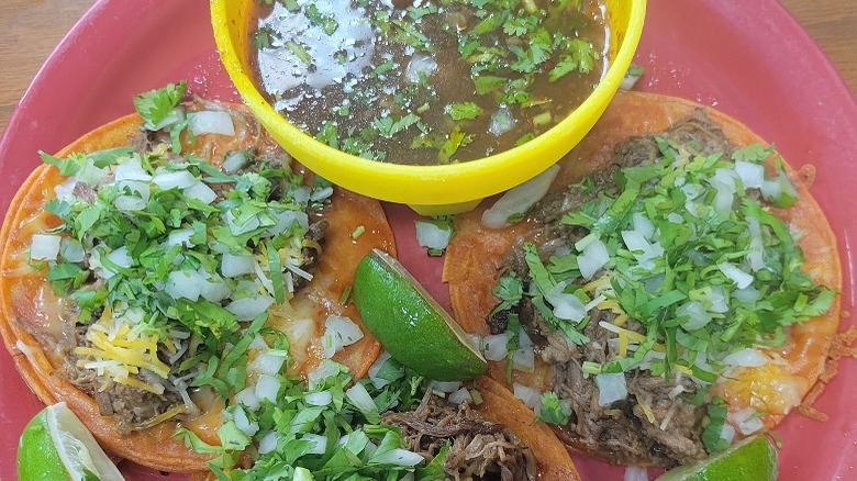 Birria tacos with consomé