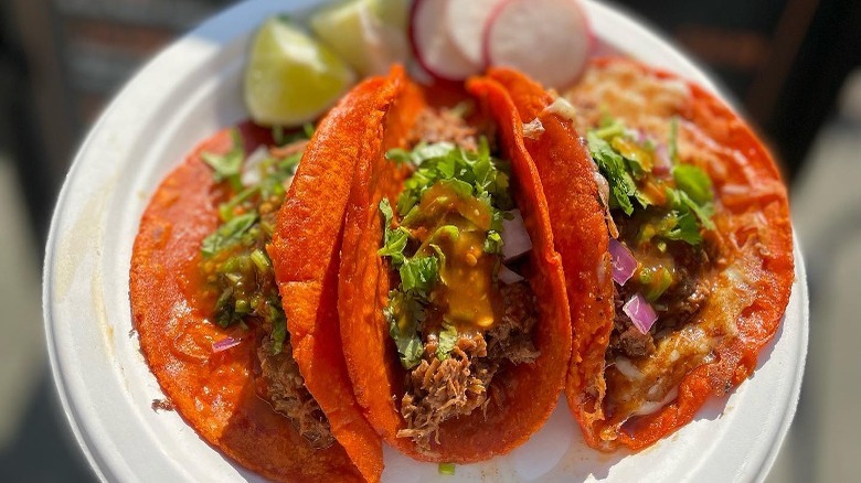 Birria tacos on paper plate