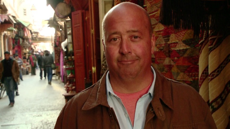 Andrew Zimmern wearing a jacket