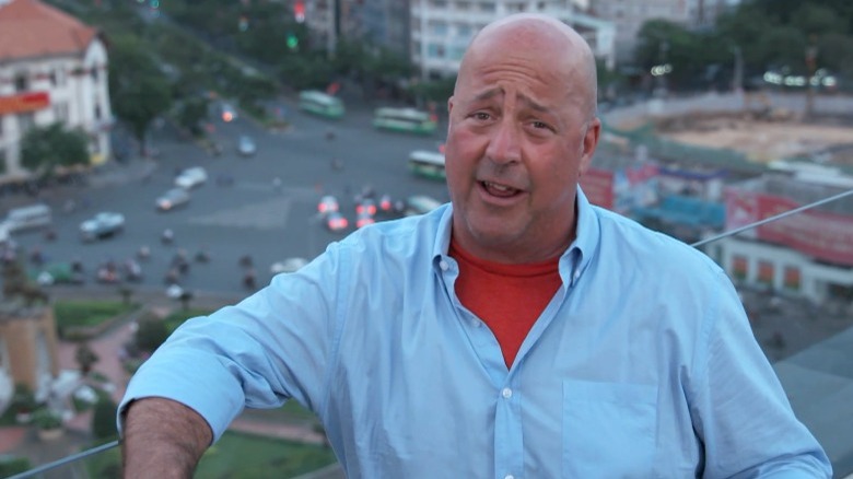 Andrew Zimmern wearing blue