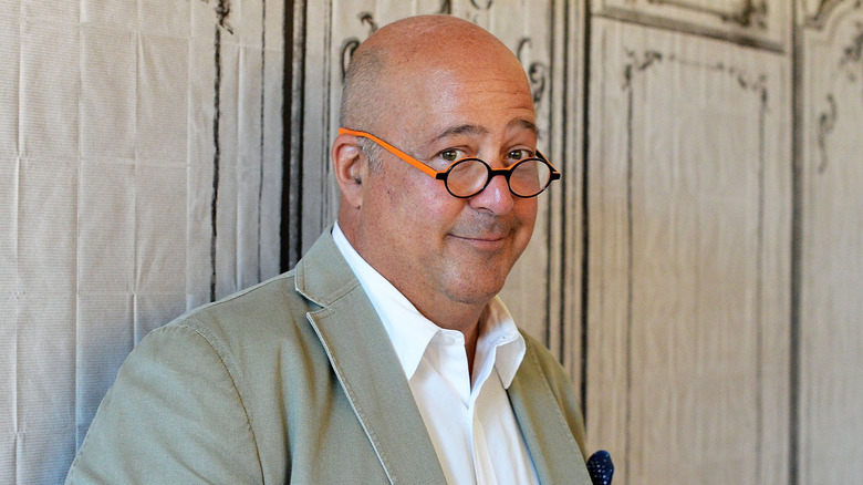 Andrew Zimmern peering over glasses