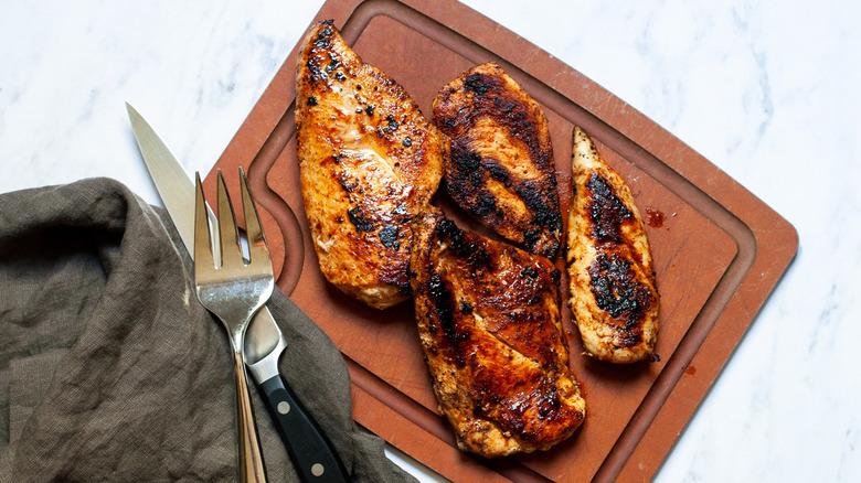 Blackened Chicken placed on a cutting board.