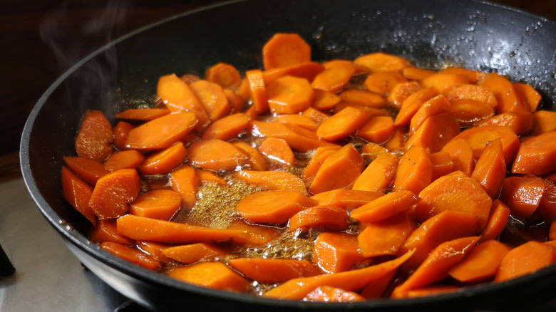 skillet of carrots bubbling in glaze