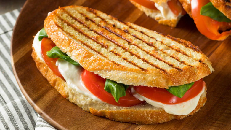 Toasted tomato mozzarella sandwich with leafy greens