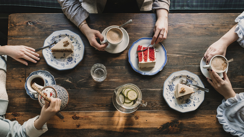 People eating desserts at a table